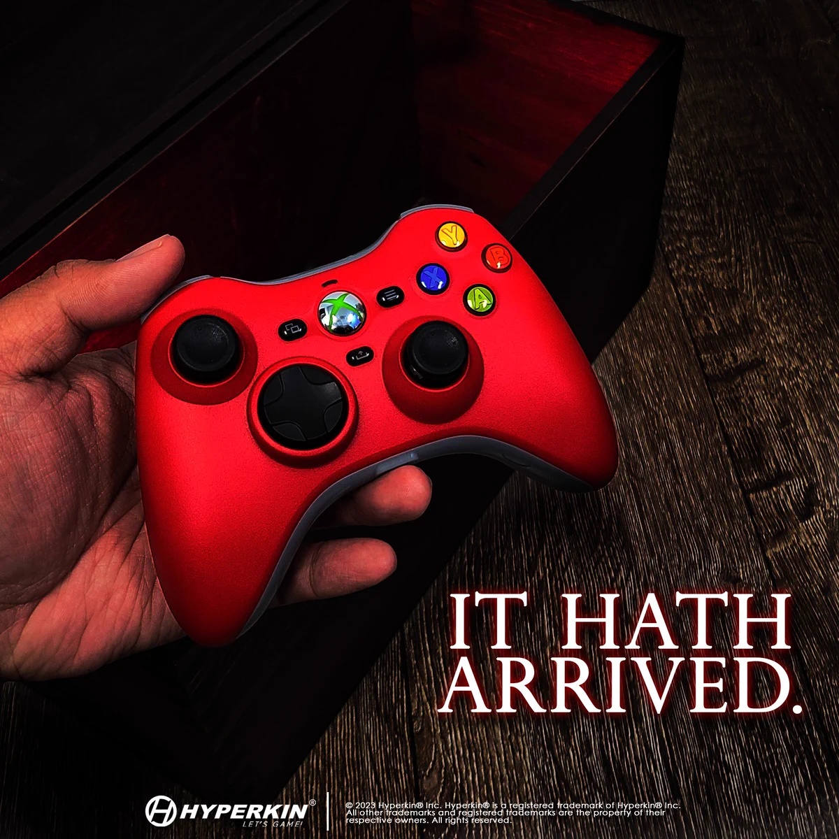 Hand holding a red Xenon over an open wooden chest glowing red. Text: IT HATH ARRIVED.