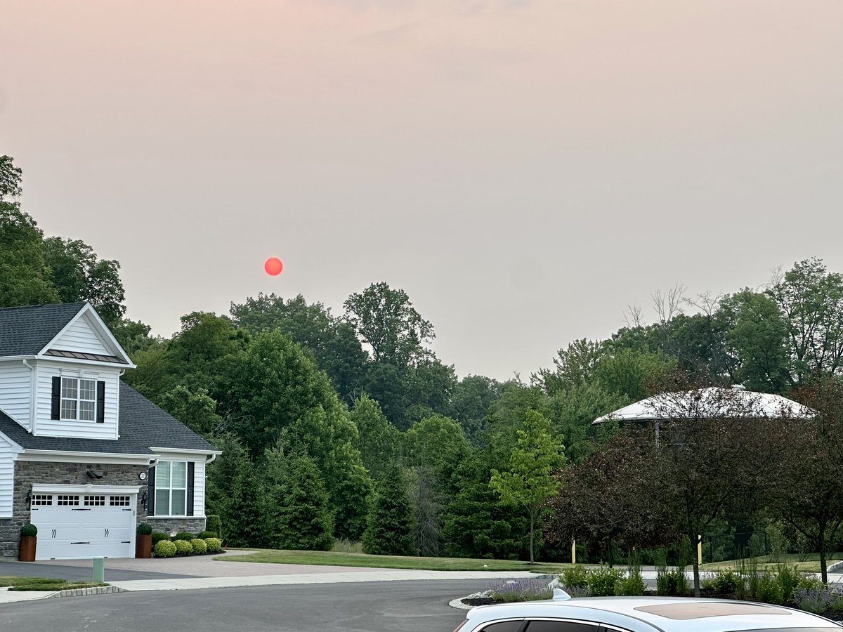 My dad lives outside of Philadelphia, Pennsylvania. The smoke from the fires in Quebec has made its way into the area. The smoke aloft is thick and the red sun proves it. He says it also smells like smoke in the area.