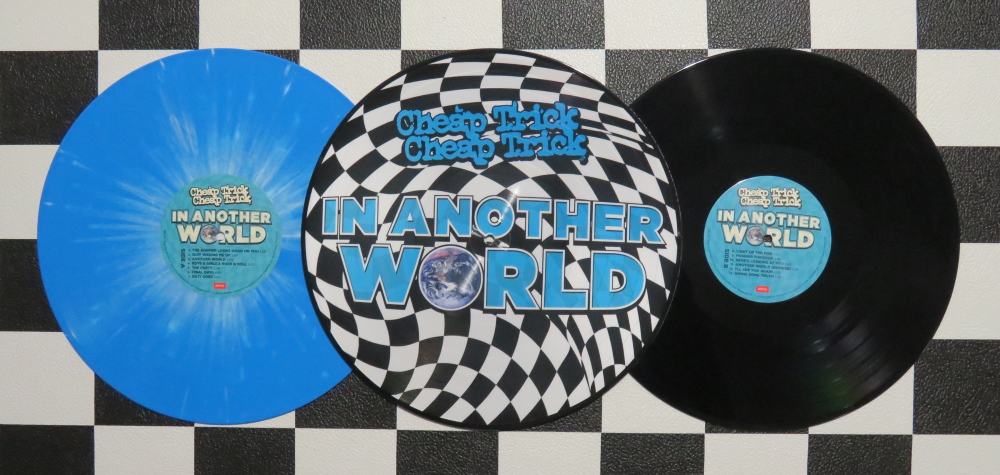Today in Cheap Trick history: 4 June – (2021) Today saw the release of three different vinyl versions of the well received “In Another World” album in the US. The picture disc, blue & white splatter, and black vinyl records followed the April release of the CD.