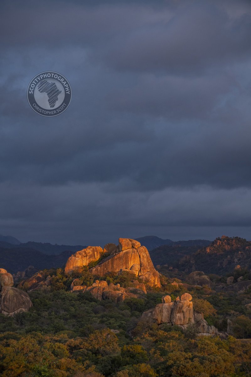 I don't know of any other landscape in Zimbabwe that quite compares to the spectacularly dramatic hills of the #matopos! The drama is accentuated even more with golden light and angry clouds! #landscapephoto #dramaticsunset #VisitZimbabwe #worldheritagesite