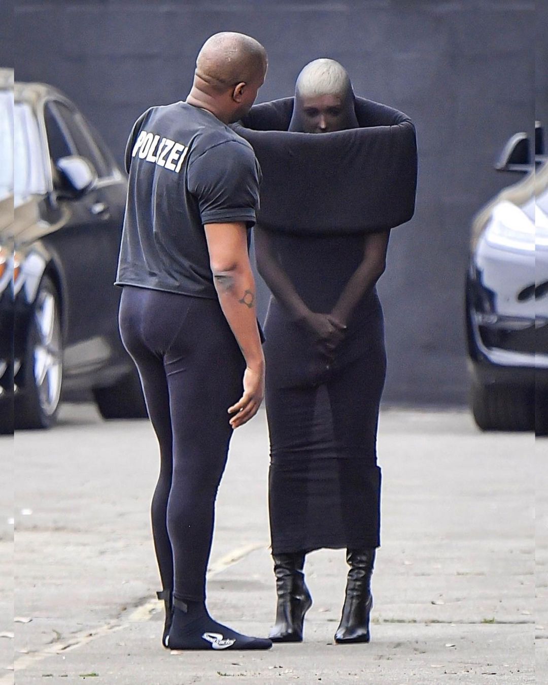 Kanye West wearing a polizei tee with spandex to church with his