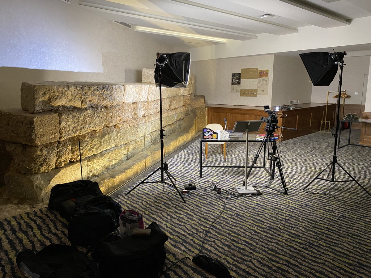 fxn's tweet image. This was the special room, you can see the recording setup there.

When the hotel was being built, they founded part of the ancient Athens wall, which you can see to the left of the picture.

Curious about how the final edited talks look like.