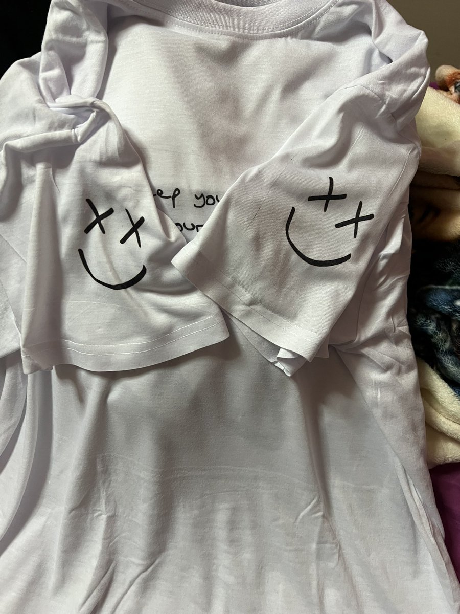 I don't think i have any other pics of it but i made a perfect now lyrics shirt with louis' handwriting for it on the front and on the back it had 28 too and louis' smiley on the sleeves