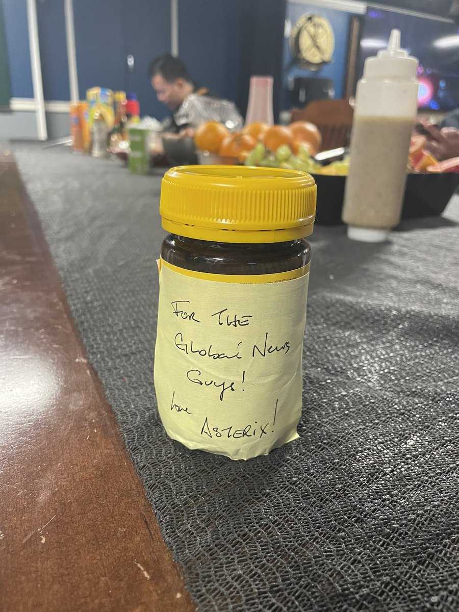 Gray_Mackenzie's tweet image. In the background of my on cam, was MV Asterix who was refuelling HMCS Montreal at the time. 

It’s tradition for ships to pass each other gifts, and the Astrix had one for our Global News team on board! 

A jar of Vegemite they must have picked up in Australia!