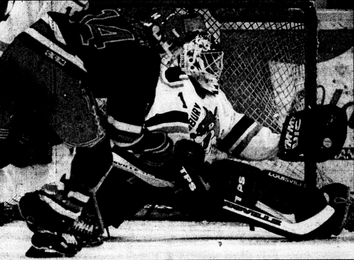 OHL_History's tweet photo. Action shot of Sudbury Wolves goaltender Dave MacDonald as he makes a glove save on Duncan Fader of the Kitchener Rangers. This game took place on November 17th 1995. Kitchener won 3-2. (Photo Credit- Ted Andkilde). https://t.co/3bqHjrnHRi