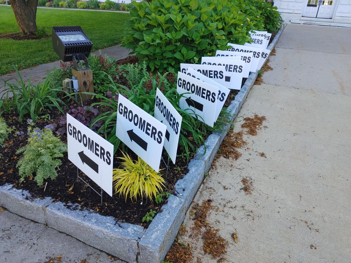 gettinviggy's tweet photo. The morning after a Pride celebration at the Town Hall in Greenwich, Conn., rows of these signs appeared outside the building. The town had them removed after consulting with its lawyers about First Amendment implications https://t.co/L5177HSg5e