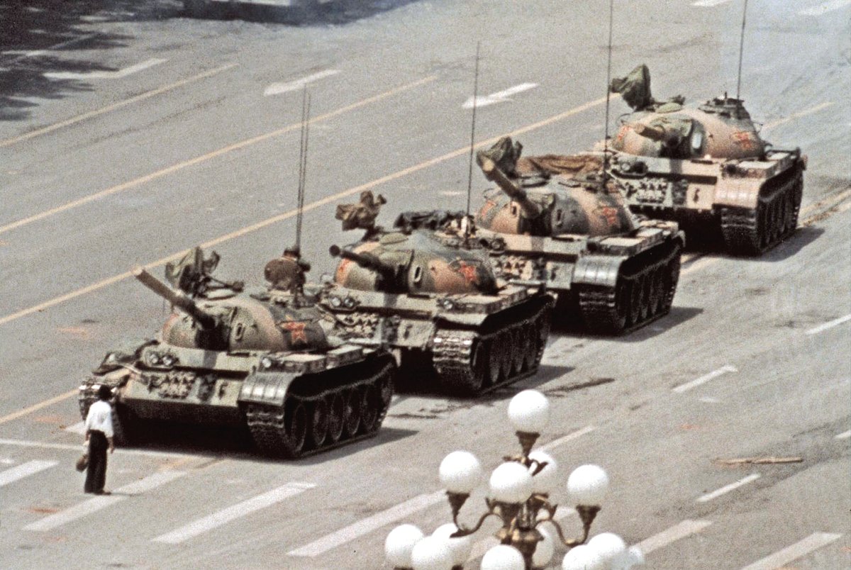 On June 5, 1989, six photographers captured a lone protester facing down a column of tanks near #TiananmenSquare. 'Tank Man' was born. This version by @JeffSWidener is the most widely published. 'I focused my 400/5.6 and waited for the instant he would be shot. But he was not.”🧵