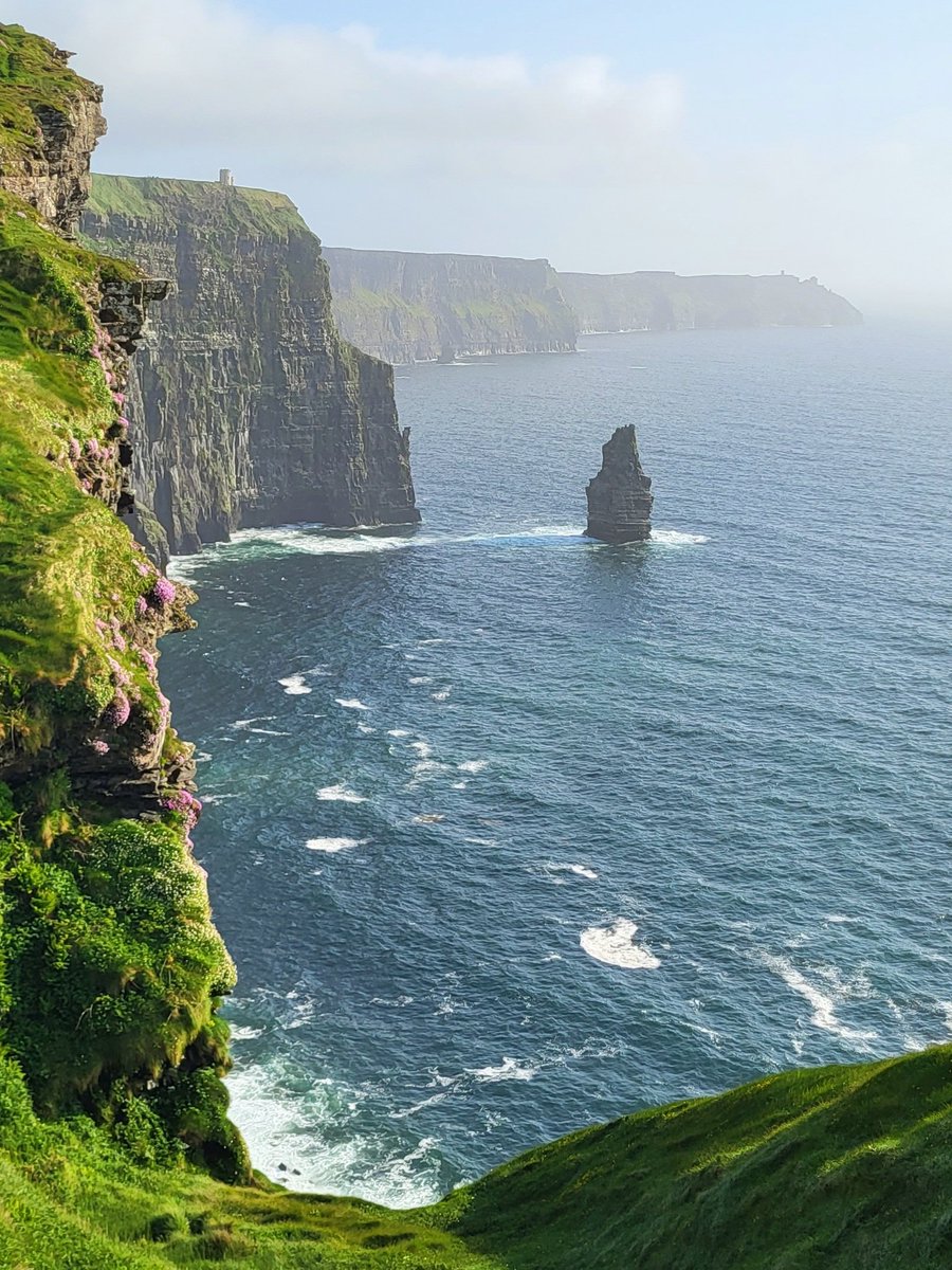 Hazy summer light at the Cliffs of Moher, County Clare, Ireland.