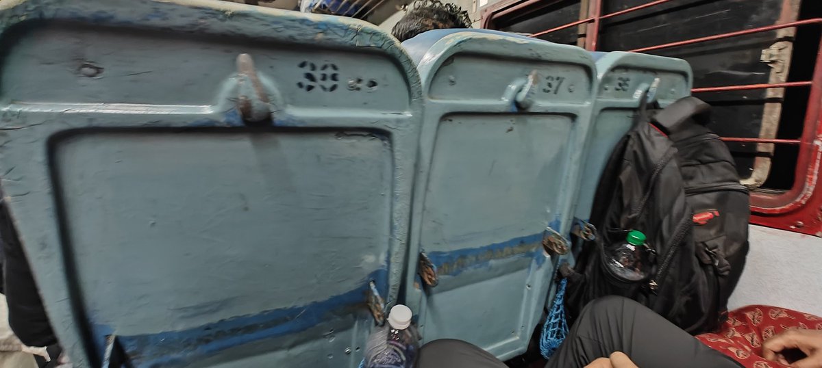 Travelling by Calicut-Trivandrum Janshatabdi. All seats are broken in the sense that the handrests and the adjustable food trays are removed. Appreciate the innovative idea of Indian Railway to convert the hooks of the removed trays as hooks for hanging bags etc.