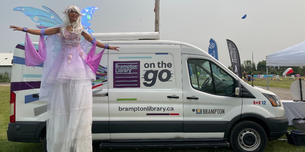 BramptonLibrary's tweet photo. It was perfect kite-flying weather at Brampton Kitefest this weekend. The sky was filled with colourful kites,  a fairy on stilts walked the grounds, and Brampton Library was there with our on-the-go van, button maker, and giant Connect Four game. We had a blast! 
@KiteFestCanada https://t.co/ZvdWEEIuTs