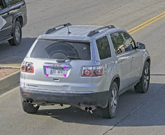Actual suspect vehicle is a 2009 GMC Acadia  with KS Temporary tag C953627.  Tag in picture is not on the vehicle.  Note dent in the rear gate below the handle.