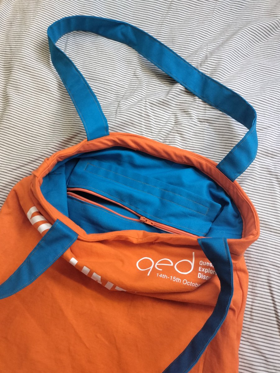 celestine__'s tweet photo. Uh oh. Dangerous reinforcement of my unhealthy hoarding tendency here

Have finally found a purpose for my @QEDcon t-shirts!

Behold, the 2017/2018 Volunteer tote bag, complete with old-branding QED-Blue lining, and little zippy pocket https://t.co/dbeCk6gdyB
