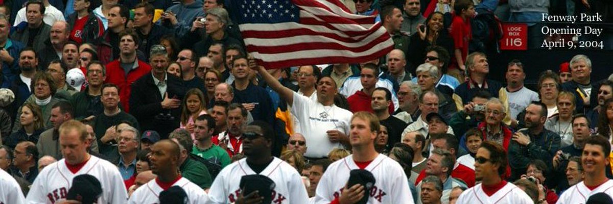 stevesilva's tweet photo. The 2004 Flag Photo

I called it my Big Ass flag. I attached it to the side of my house after 9/11, not alone on that one. A few of us had been going to Opening Day at Fenway since ’99-2000, but this was the first time I brought the flag in. It did not have a pole, just a plastic tube to hold onto, making it extremely difficult to wave, which I only did during the last five seconds of The Star-Spangled Banner. Furiously, I might add. And yes, absolutely I am taking 110 percent of the credit for the way the season ended up after my flag waving kicked things off with a bang.

The seat.
Prime spot. Lower box, first base side. You would not guess who was on his way to sit in them if I gave you a thousand and ten guesses. Give up? Former Ch. 7 reporter and anchor Sean Hennessey, who was coming down the aisle as I scampered away before the first pitch. Totally random.

The crowd.
My favorite is the guy in the red jacket, left of flag, next to hand-on-his-heart guy. I don’t know what’s going on in the neck region, but he is Marlon Brand-on Boston Guy in 2004. And he does not give a flying #@&! that the Red Sox had reportedly not won a “World Championship” -- as Joe Castig would say … … IT’S CALLED THE WORLD SERIES IN BASEBALL JOE! THREE TIMES JOE!!! THREE #@&% TIMES!... but I digress… WHO THE FUCK SAYS “BASEBALL’S WORLD CHAMPIONSHIP?!?!?!” THREE FUCKING TIMES. CAN YOU BELIEVE, IT?!?!?! ... I’m sorry, but this guy is basically Biden in the booth. Another story for another day.

Players in view:
Left to right: Schill, pretty sure Pokey Reese, David, D-Lowe, Todd Walker, and Stabbed by Foulke.

The picture taker:
Venerable Globe photographer and World-Class guy, Bill Greene. One of the all-time greats. The photo appeared below-the-fold on A-1 the next day.

The game.
Home opener, Friday, April 9 vs. the Blue Jays. The Sox came home 2-2 after opening in Baltimore. They lost 10-5, Bronson and Timlin got lit up pretty good.

Opening Day 2004. How it started/You know how it ended.