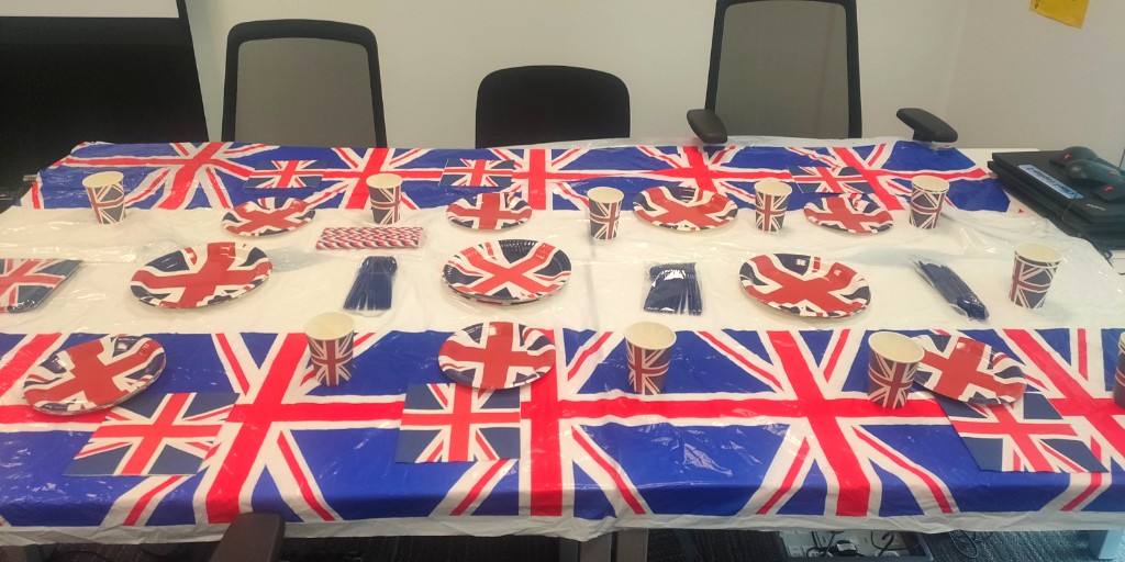 SeetecPluss's tweet photo. The King’s Coronation-themed event celebration at the Seetec Pluss London Uxbridge Office was also dubbed the BIG Coronation Lunch, as all of the team here were treated to yummy lunch of their choosing – courtesy of our local Cafés. #NoOneLeftBehind https://t.co/wOs5XD5QiK