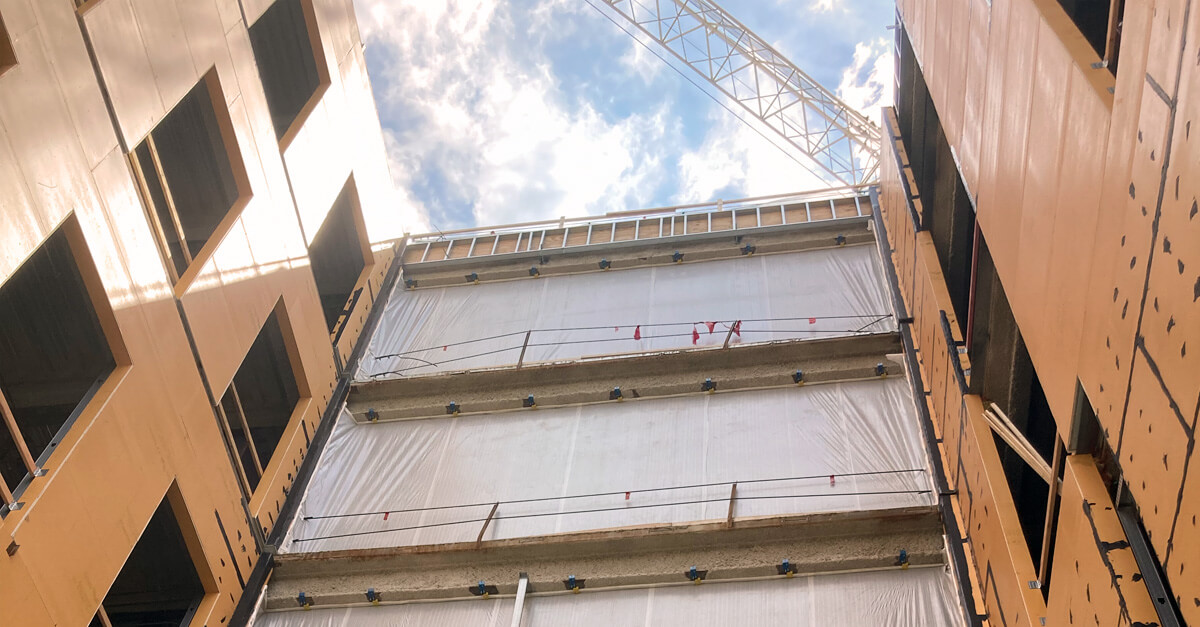 Beat the summer heat, wind &amp; rain with TuffWrap’s Resilient Temporary Weather Barrier. TuffWrap EXT Temporary Exterior Walls Stand-Up to Weather. It enables a company to stay operational during construction or renovation while keeping people. tuffwrap.com  #TuffWrap