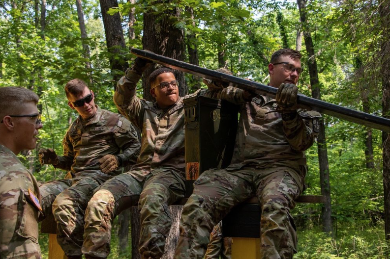 Jayhawk sighting at Cadet Summer Training (CST)! Check out CDT Daniels @seth1daniels, the second Cadet from the left in this epic photo. 💪 They're tackling the Leader's Reaction Course, a challenging teamwork exercise. 🌟 Go Jayhawks! #CST2023 #LeadershipJourney #leaderswanted