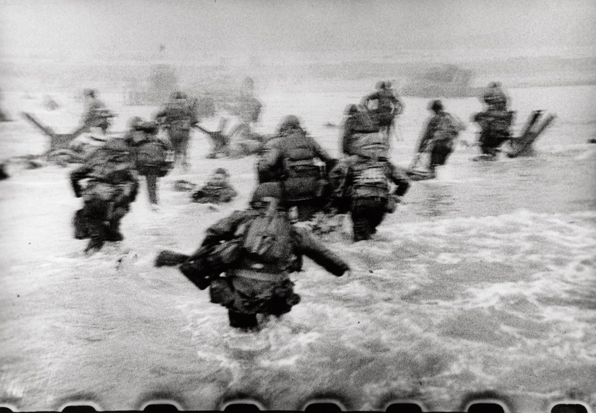 Photo taken by photojournalist Robert Capa moments after American troops land at Omaha Beach on June 6, 1944.

#History #WWII #DDay79