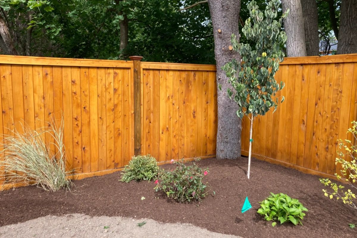 Just look how much a new fence can brighten up a yard. If there are obstacles in the way, we'll gladly plan the fence to accommodate. That's the power of #CustomFencing.