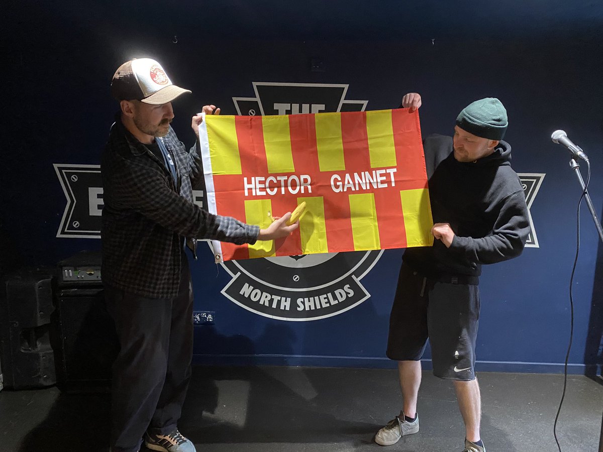 Flags have arrived, as modelled here by Aaron and Martin/plus banana of @HectorGannet - free pint with every flag. Only available in the venue £15