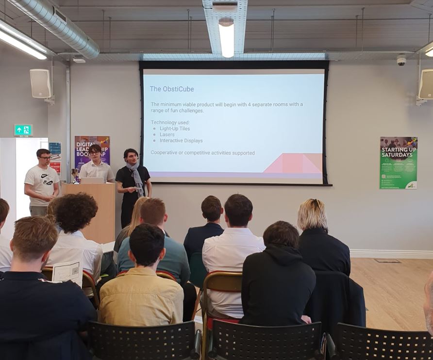 Team 2 is ObstiCube.

Their solution is to create a four-room activity centre, complete with light-up tiles, lasers and fun challenges, all alongside an app to customise your experience.

Not only will users be active, but they'll have fun too!

#DigitalInnovatorsProgramme