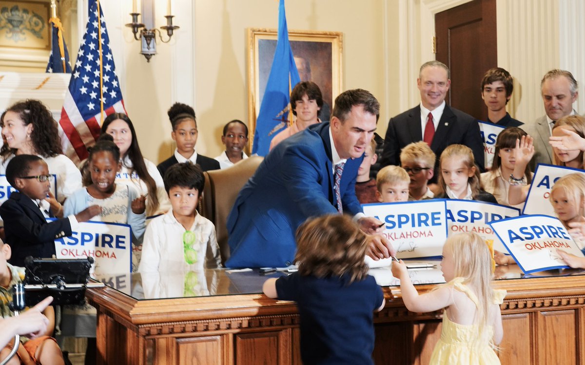 GovStitt's tweet photo. I’m so proud to have just signed a first-of-its-kind education freedom package into law— The ASPIRE Oklahoma Plan. 

Now every parent can send their child to a school that best fits their needs regardless of their background, economic status or zip code! https://t.co/PjNBQPjnMc