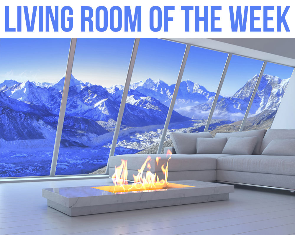 This living room could also easily be the View of the Week. Other than the amazing view, the simple, white interior looks clean and modern. It goes without saying that the open fireplace is the coolest piece in this Living Room... facebook.com/11476047322399…