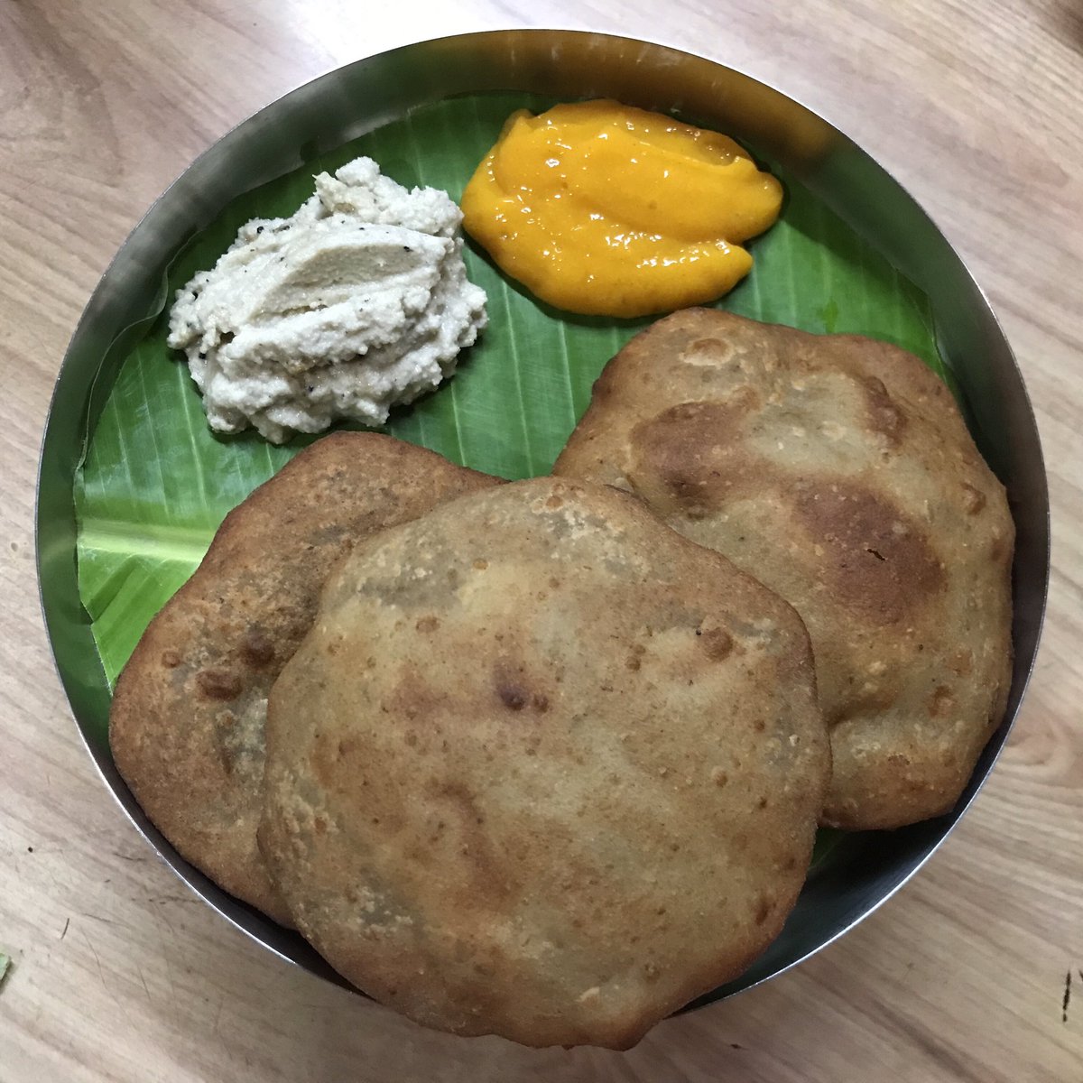 LouvinaA's tweet photo. When life gives you bananas, you make Hot Mangalore Buns with cool coconut chutney and aamras. @KamathGurudutt @anilbhatortho (cup of cold coffee later) https://t.co/NyHAF4m8kn