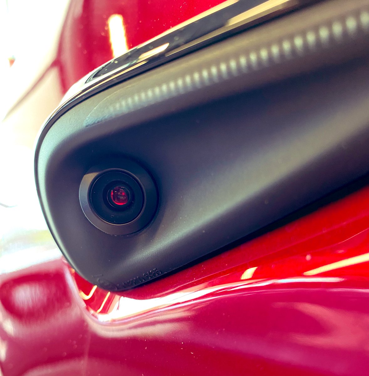 Sprinkler's tweet photo. Today at #tesla in Dedham Mass: Model X in cherry red. Cameras’ mysterious red glow regardless of paint. #Hal - #YesDave? https://t.co/0dPa5kqqrl