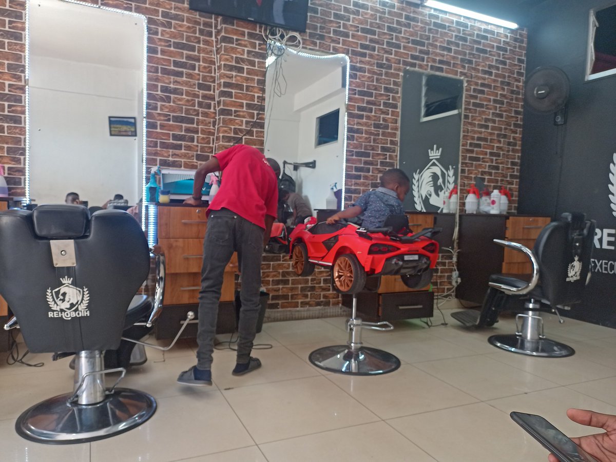 I'm in this barbering shop in Lilongwe, Malawi and kids have a special seat.

📍 Rehoboth Barbering Shop