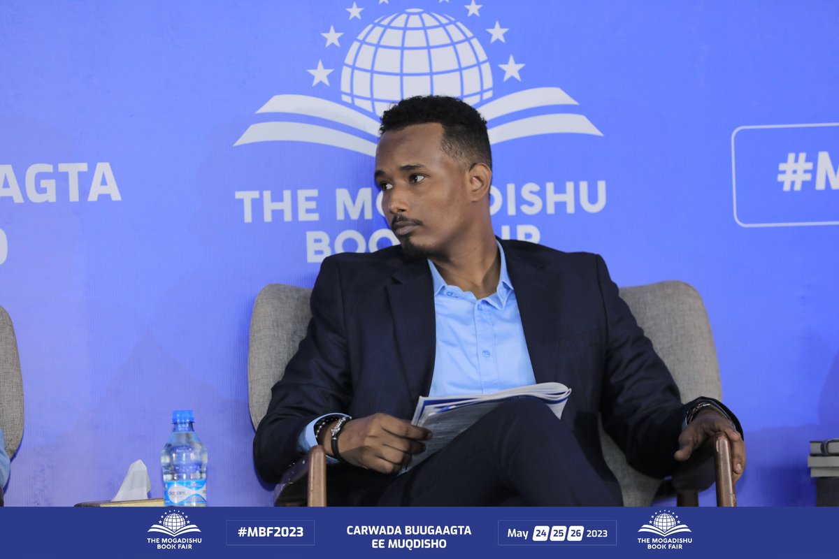 MogBF's tweet photo. What better way to start day 3 of #MBF2023 than with a captivating panel discussion? Moderator Yaasir Osman speaks with authors Abdikadir Abdulbari, Nimco H. Osman, and Bahja Jama as they chat about their latest projects. A must-see for all book lovers. https://t.co/cu0a3qyak7