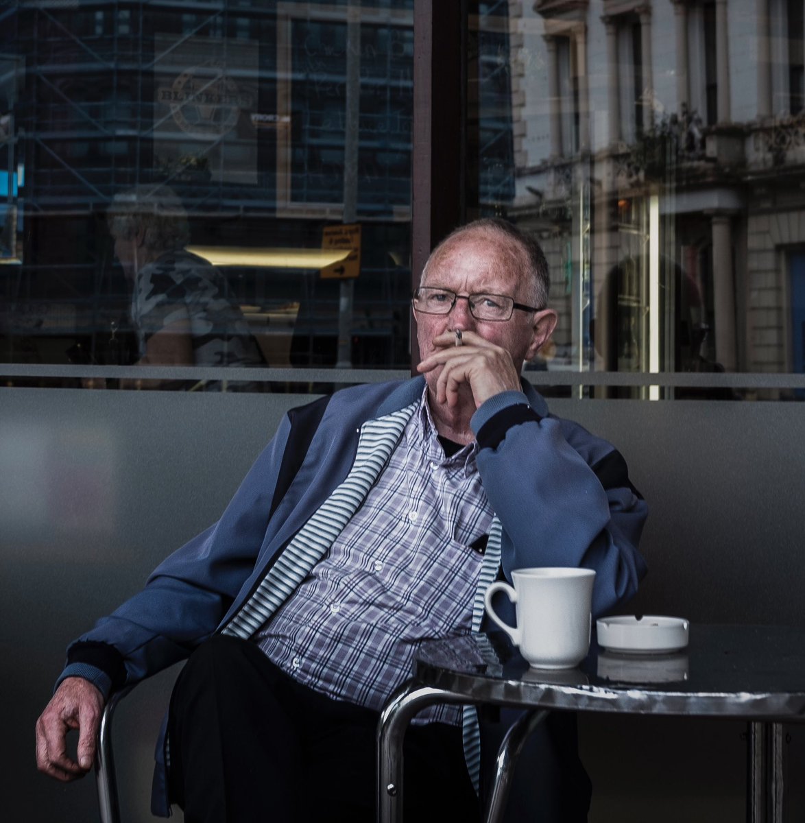 Coffee and a smoke. #belfaststreets   #documentary-photography #fromstreetswithlove #capturestreets  #gf_streets #streetdreams #timeless_streets #streetphotographyworldwide #hcsc_street #obscureshots #streetphotographersmagazin #cobblescope #tnscollective