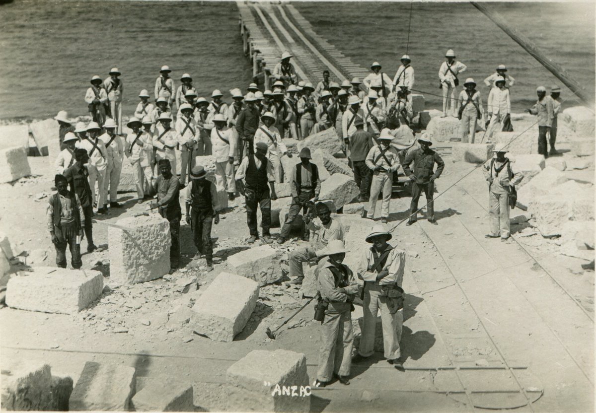 #Gallipoli #Çanakkale #CWGC #WarGravesWeek Building remembrance. The pier below Walker's Ridge in the Anzac sector, used by the commission to land stone used for cemeteries in the area. Commission workers hard at it during a visit from Royal Navy types circa 1922.