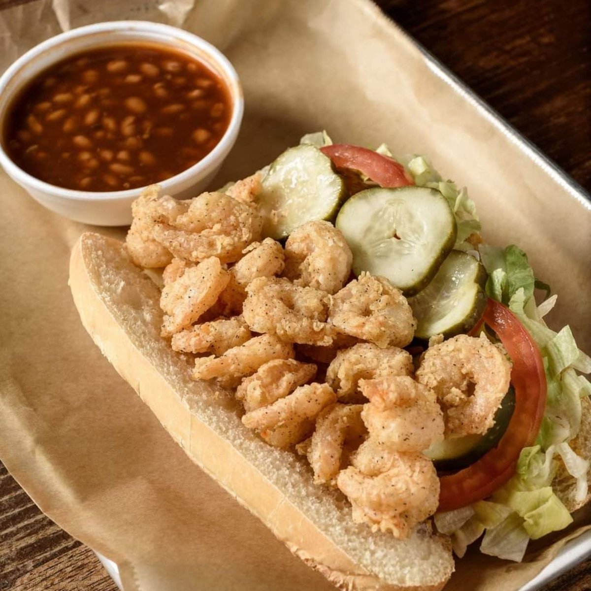 voodoobbqpcola's tweet photo. It's #FriYay! 🎉 That's #ShrimpPoBoy day in our world!  🤩 Golden fried shrimp, piled high on #Leidenheimer French bread 😍 perfect start to the weekend! 😋 To order pick-up, delivery, rewards, or #catering, click this link: https://t.co/XgXwPPOhRQ https://t.co/OIuWJFSm86