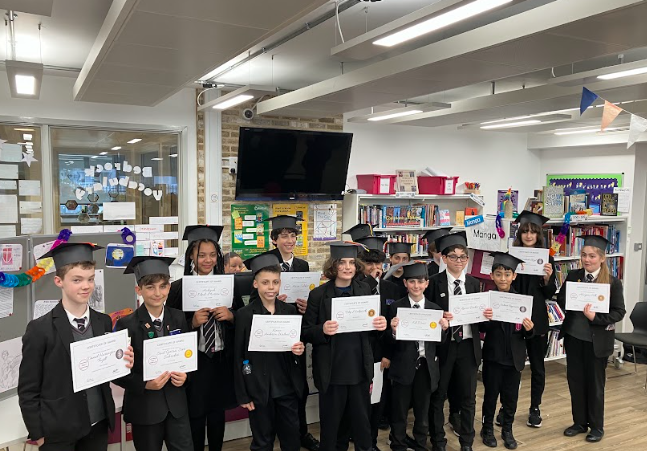 ChelseaAcadMAT's tweet photo. On Thursday, we celebrated our Year 7 Challenge Passporters with a graduation ceremony in the library with cake, speeches and displays of their work! https://t.co/rzBGi6Pe0L
