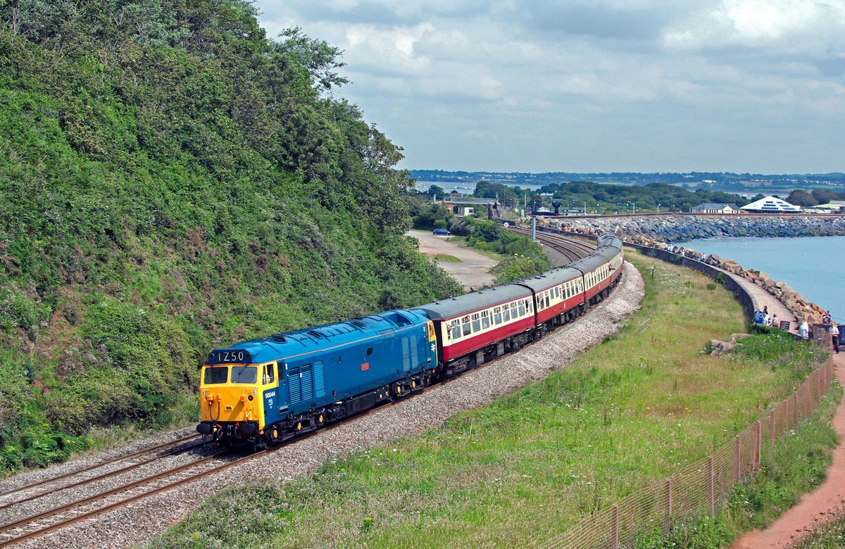 Feels like Summer 📸 ☀️ 😅
BR Blue 50044 'Exeter' leans into the curve at Langstone Rock with the 1z50 Cardiiff - Paignton. 21st July 2012.

➡️🏞🚂 etsy.com/uk/listing/117…

#class50 #dawlish #devon #dawlishwarren #gbrf #brblue