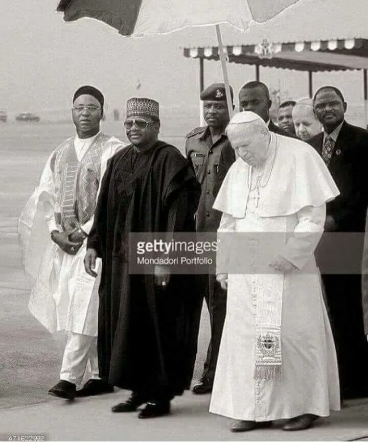 Major-General Abdussalam Abubakar, General Sani Abacha and Pope John Paul II in Abuja during the latter's papal visit to Nigeria, March 23, 1998. 

Photo Credit: Getty Images