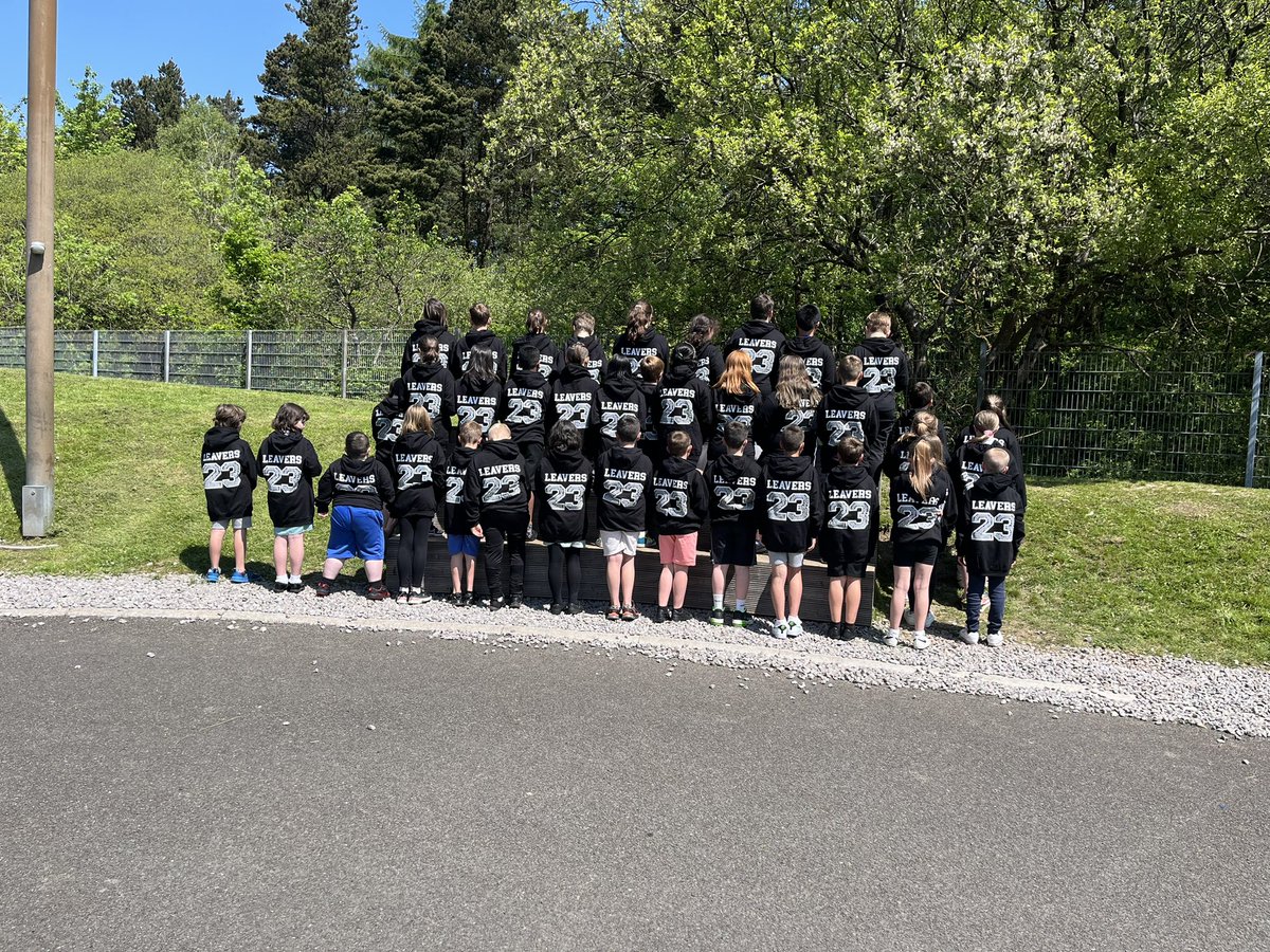 Year 6 proudly showing off their hoodies