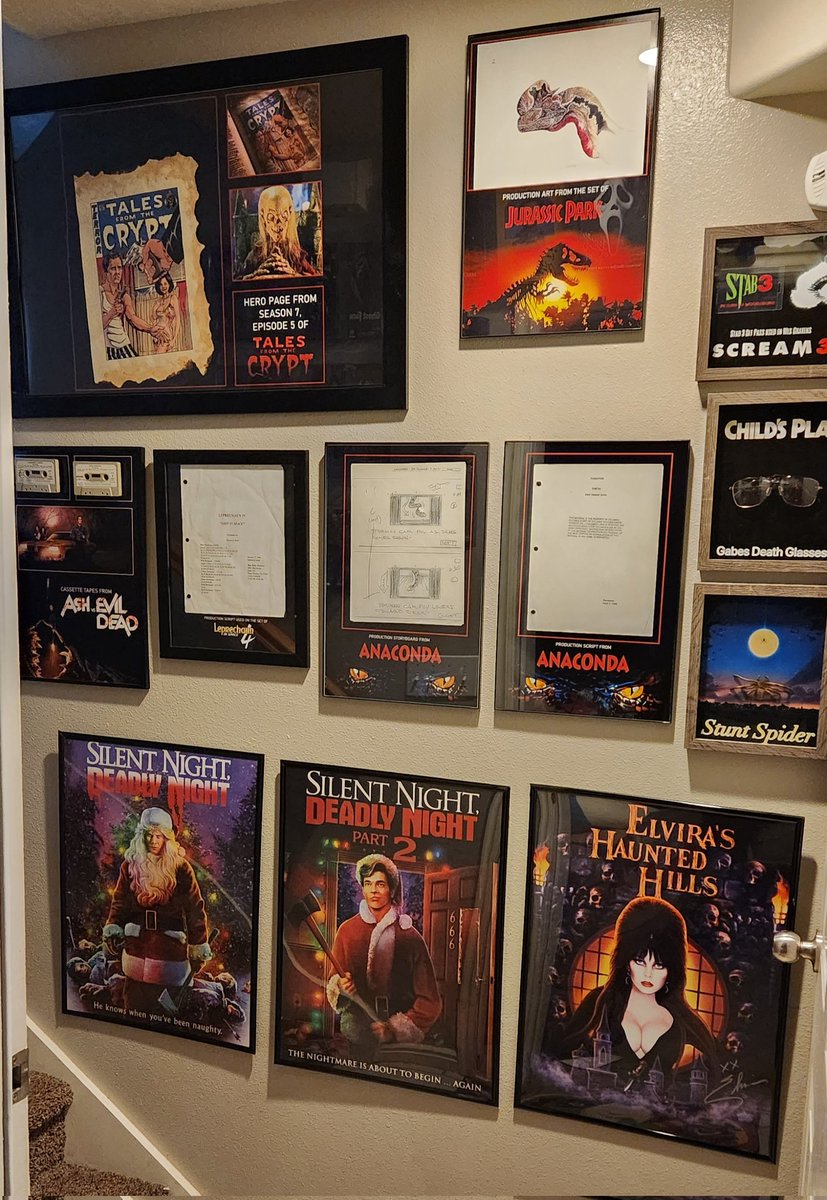 My wall of movie props and @Scream_Factory posters.