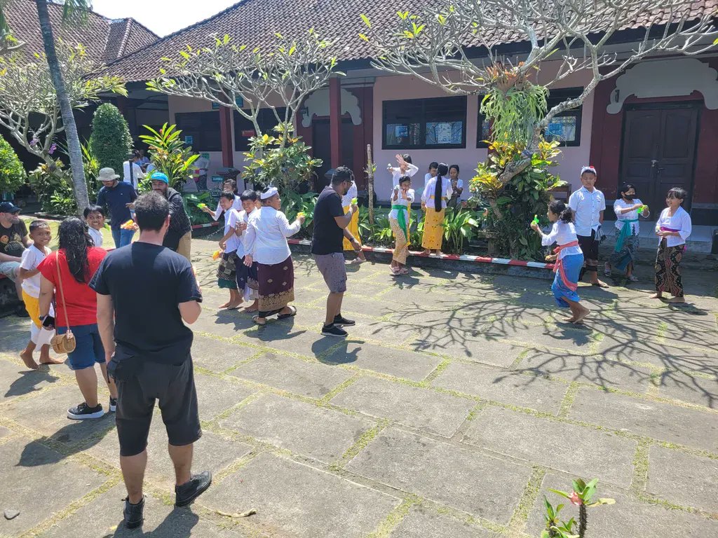 wpmudev's tweet photo. A highlight of our Bali retreat was visiting a local school and showing the kids who the real water fight champions are. 😎 🔫 💦 

We were even lucky enough to be treated to a performance after. 🎶 

Incredible experience. 👏 

#INCSUBALI #BaliRetreat #WPMUDEVLife https://t.co/t3GIB1MyOR
