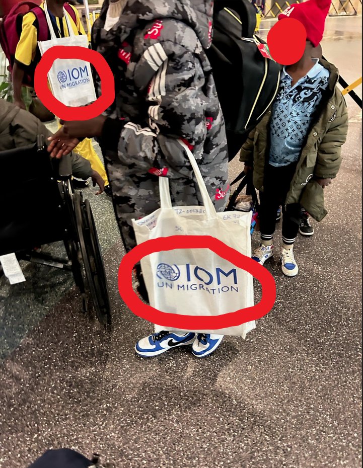 NEW: Citizen journalist in Boise, ID sends us photo of illegal aliens with United Nations IOM paraphernalia. Says 15 buses every night are coming in from Spokane and Eastern Oregon. A wave of illegal migration sponsored by globalist organizations to the heartland.