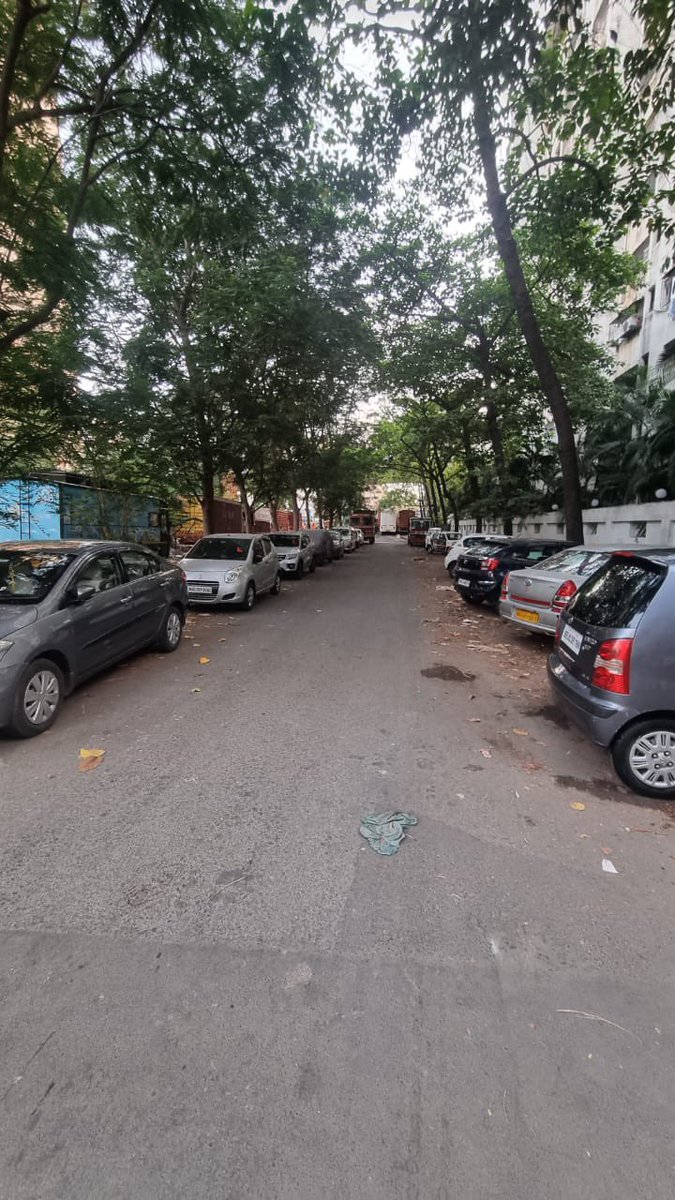 Anju0008's tweet photo. newly opened DP road Rammandir road Goregaon West has become parking lot for trucks and loo vans which are being used for illegal activities often. Exit point and society gates are blocked by garbage trucks. No action by police or MMRDA. https://t.co/j4a1zqaxfW