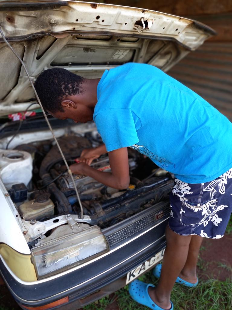 This is my son.
Teach them the basics. 
You can start small like changing a tyre, toping up fluids, checking plugs, tyre pressure etc.
No one's child should spend the night on the road because of a small breakdown.
Keep the garage school going!