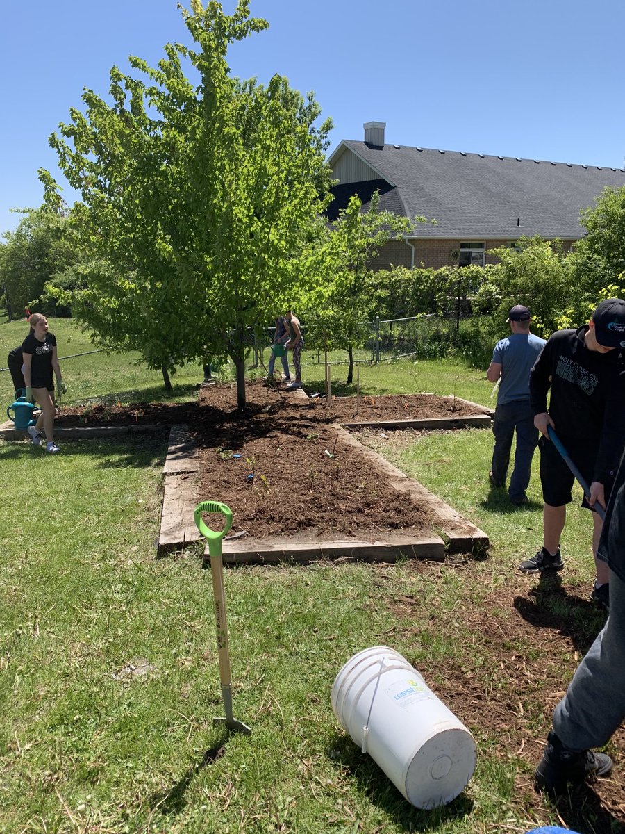 ⁦<a href="/HolyCrossPTBO/">Holy Cross CSS</a>⁩ We are so proud of our Environmental Science classes and the Bee Club who have designed this ‘Cross’ garden and planted veggies. These students have worked hard making this garden beautiful! #WeAreHC #pvncinspires #happychappy