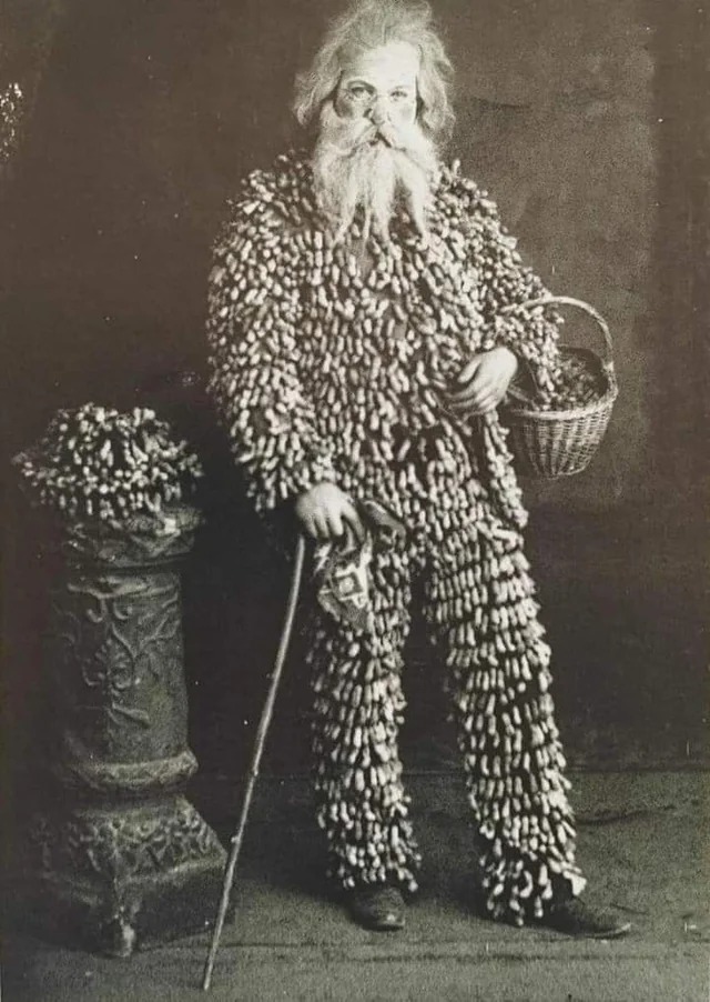 A peanut vendor from 1890, wearing a suit made of peanuts.