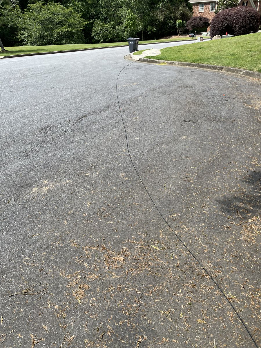 This is the new <a href="/ATT/">AT&T</a> fiber service! Live glass wires in the street and over the yard.  This is real high tech service. Shameful. Do better!