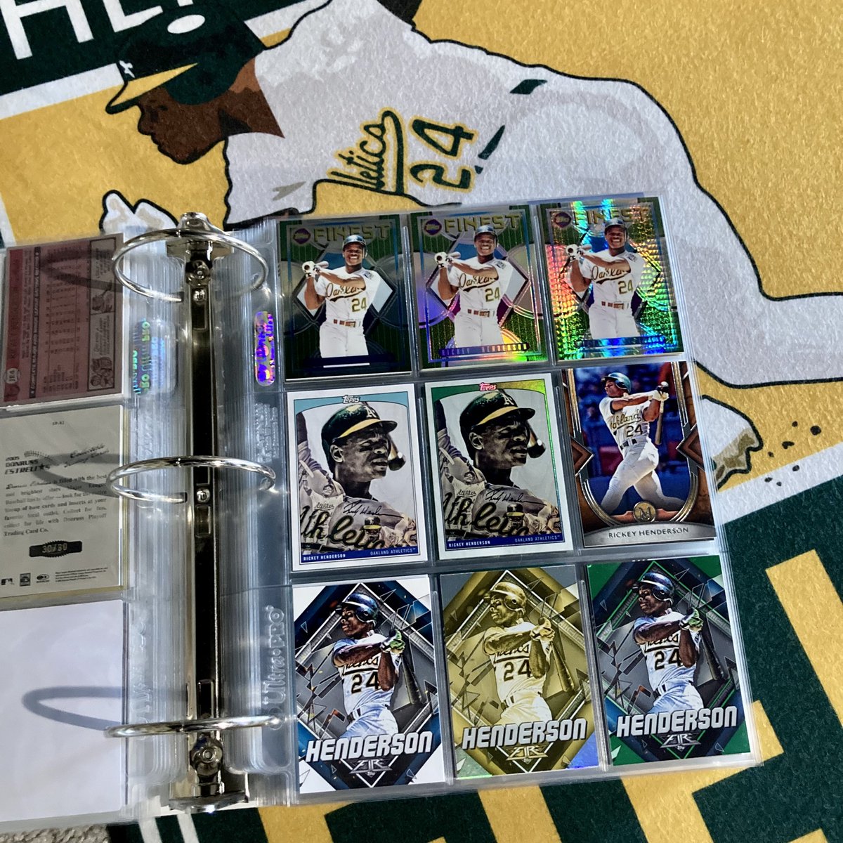 Todays Rickey Henderson PC swag is this random binder page highlighting various 2022 @Topps pieces of flair! Love the Green @ltillustrations in the middle, incredible talent…@CardPurchaser 🔥💚👀🐐⚾️🏃🏿💨🧤#rickeyhenderson #thehobby