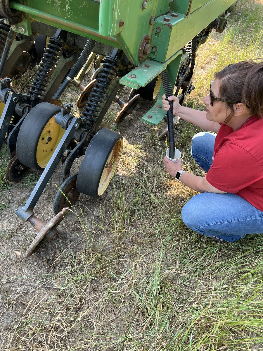 CountyUaex's tweet photo. Boots on the ground helping area farmers , while many see a grain drill and think of rice , soybeans or other row crops Amy Tallent and I are helping calibrate this rig to plant common Bermuda grass , after some continued adjustments they’re ready to go . https://t.co/nUj5C33uBk