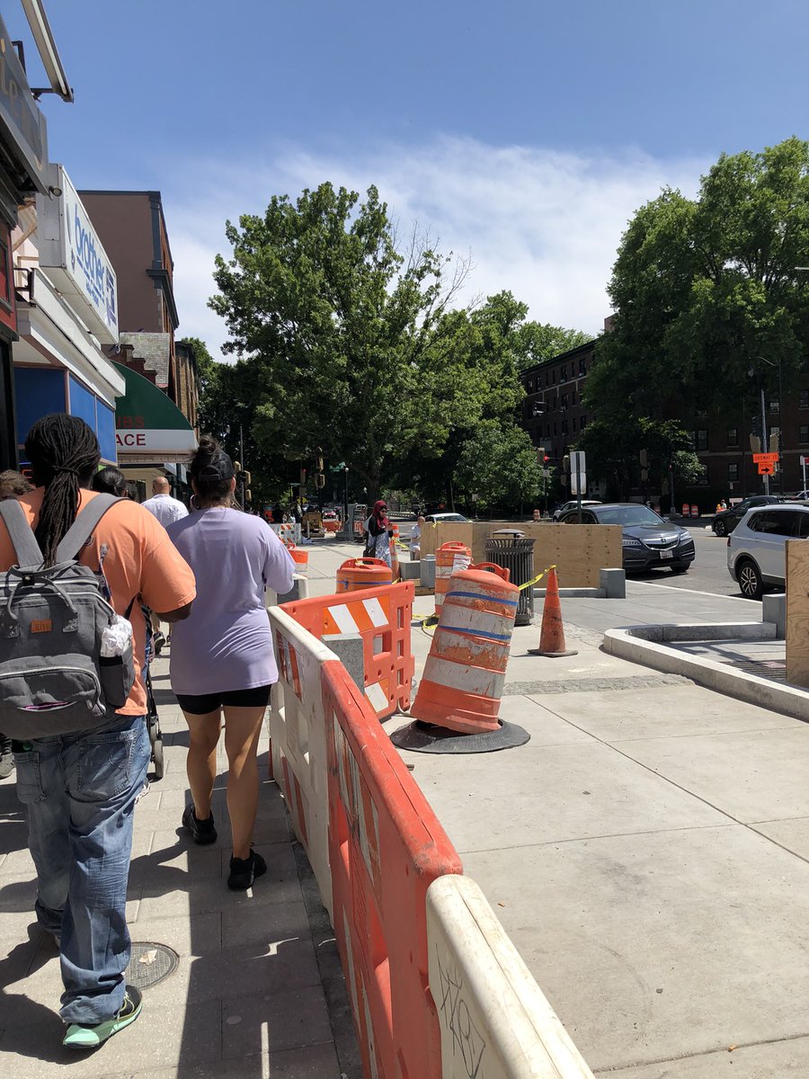 WRyanMcCann's tweet photo. We can do better than this. Single file walking lane for pedestrians all in the name of car storage. Insanity. https://t.co/IPhwbk0vSK