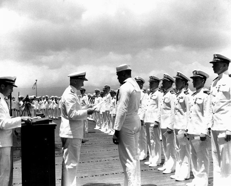 NavalInstitute's tweet photo. #OTD in 1942, Doris Miller was presented with the Navy Cross by ADM Chester Nimitz for his heroic actions during the attack on Pearl Harbor. Miller was later killed during the Battle of Makin in 1943. The fourth Gerald R. Ford-class aircraft carrier will be named in his honor. https://t.co/lk6MqUNW9Y