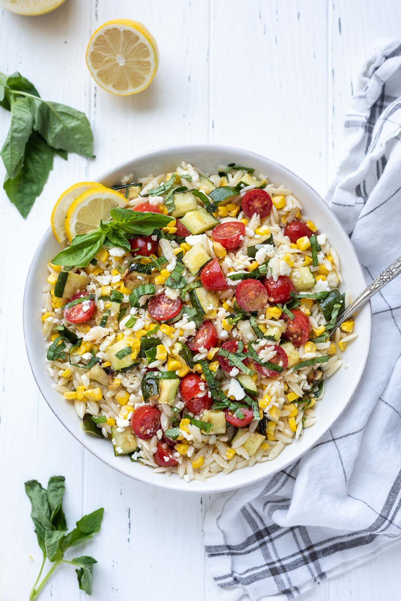 Lemon Orzo Pasta Salad is summer in a bowl! It's brimming with summer vegetables, basil, creamy feta cheese and it's tossed in a fresh, tangy lemon salad dressing! #sidedish #pastasalad #MemorialDay 

flavorthemoments.com/summer-vegetab…